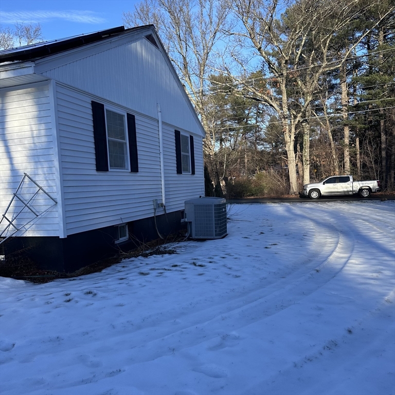 1163 Whipple Road Tewksbury, MA 01876 - Photo 29 of 31 a view of a house with a yard