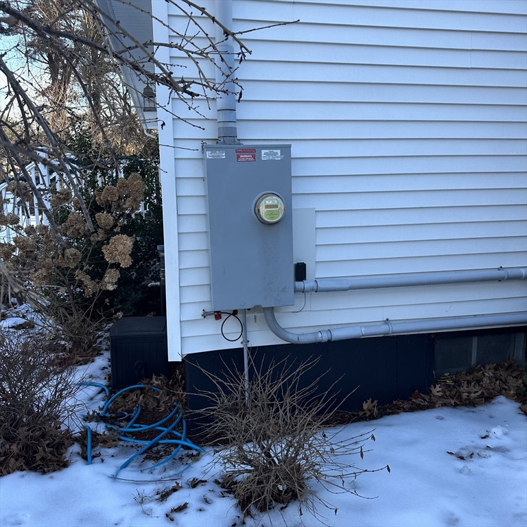 1163 Whipple Road Tewksbury, MA 01876 - Photo 31 of 31 a front view of house with a garden