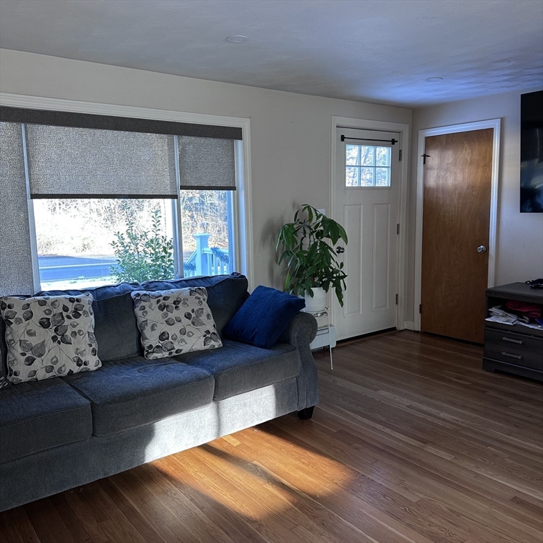 1163 Whipple Road Tewksbury, MA 01876 - Photo 4 of 31 a living room with furniture and a large window