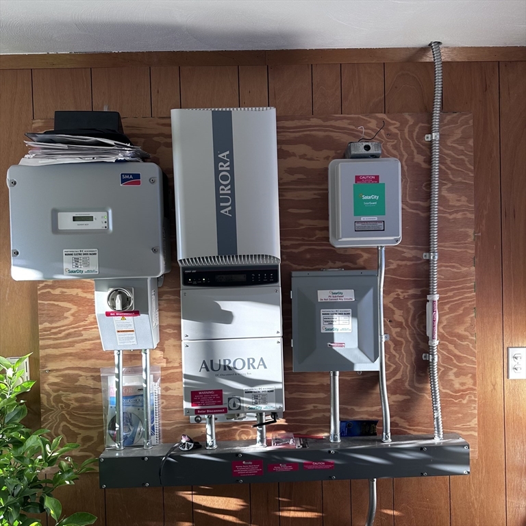1163 Whipple Road Tewksbury, MA 01876 - Photo 6 of 31 a view of storage and utility room with washer and dryer