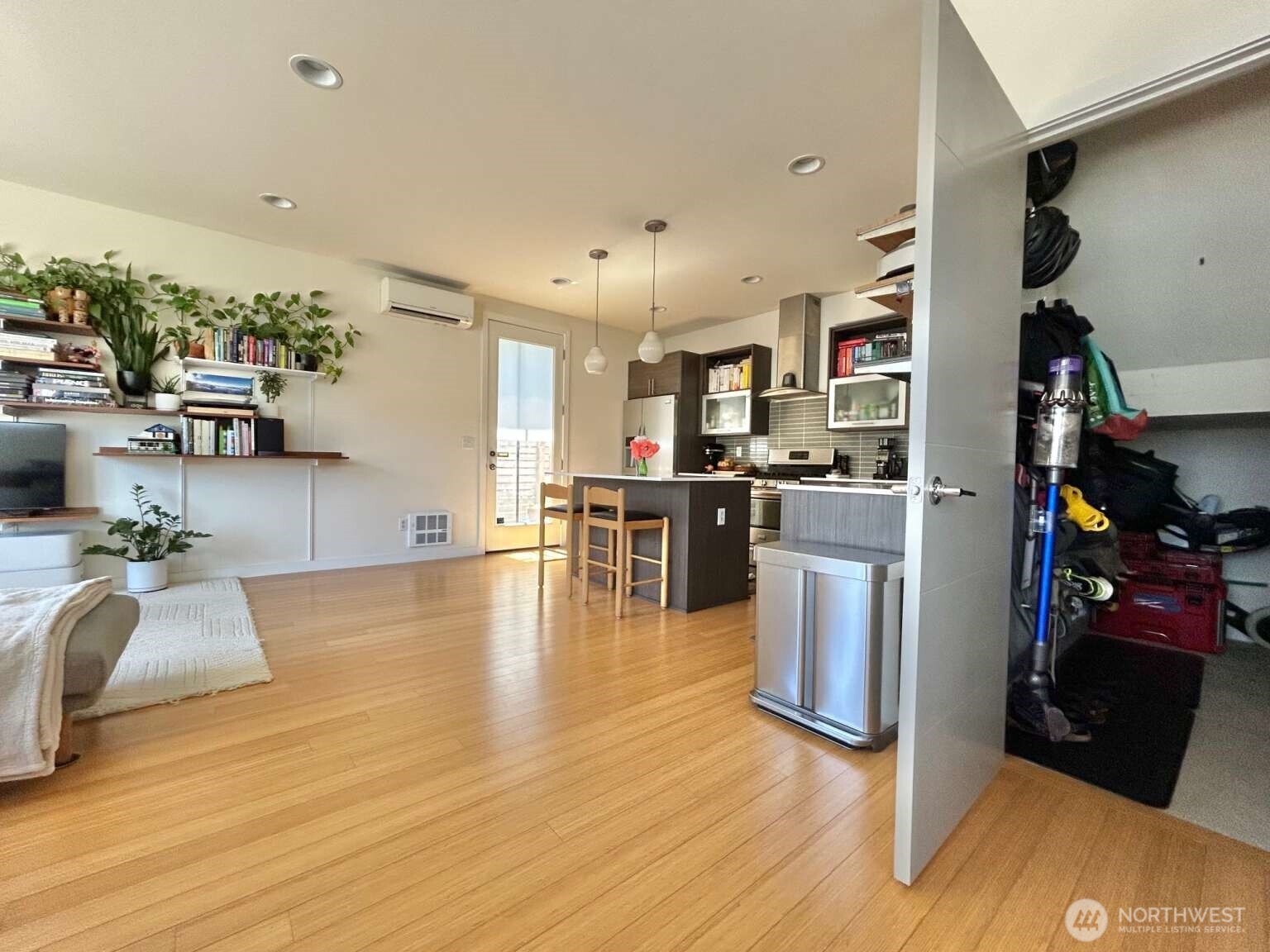 4852 40th Avenue Southwest, Unit B Seattle, WA 98116 - Photo 11 of 25 a kitchen with stainless steel appliances kitchen island granite countertop a refrigerator and a sink