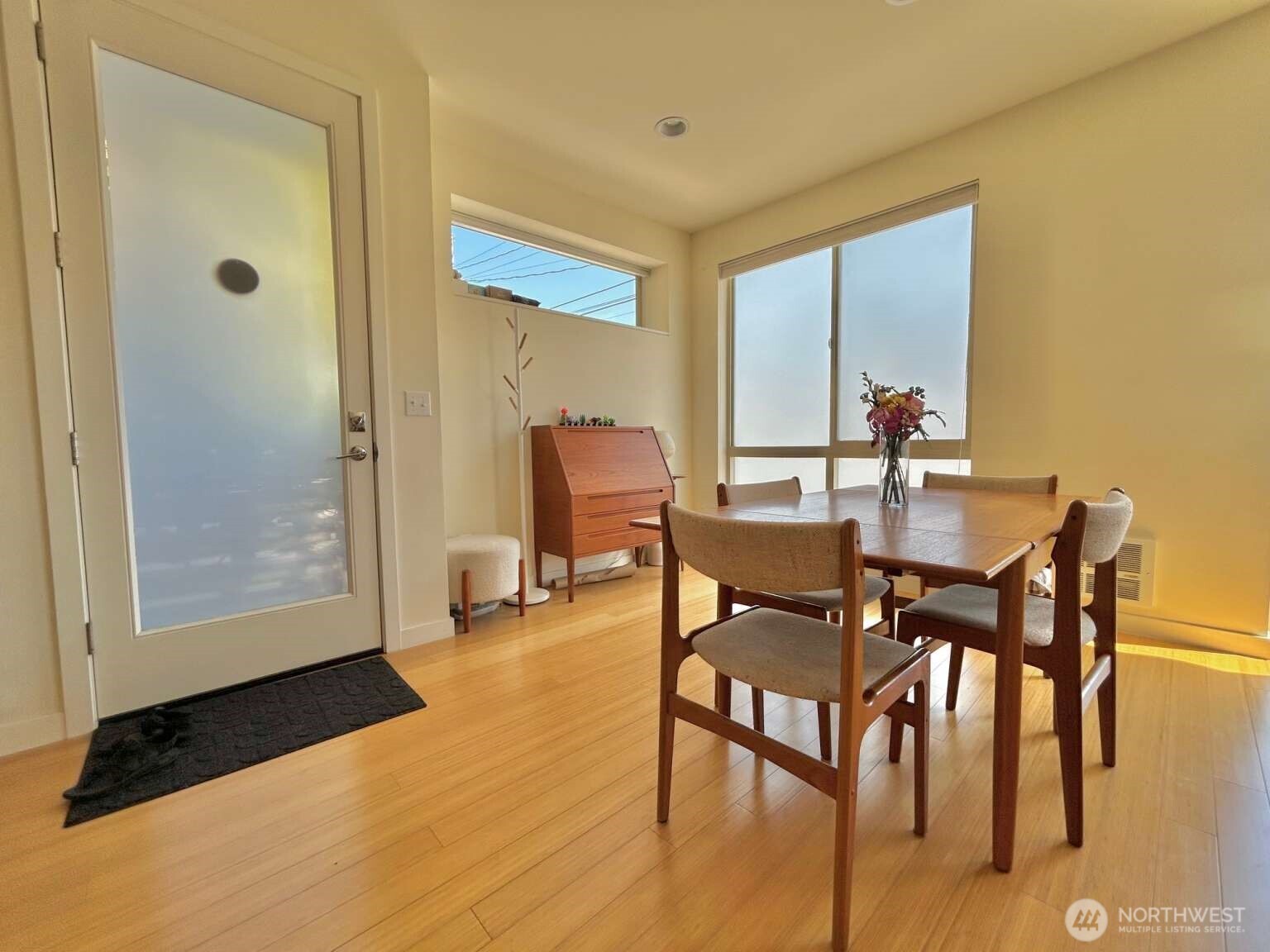 4852 40th Avenue Southwest, Unit B Seattle, WA 98116 - Photo 3 of 25 a dining room with furniture and wooden floor