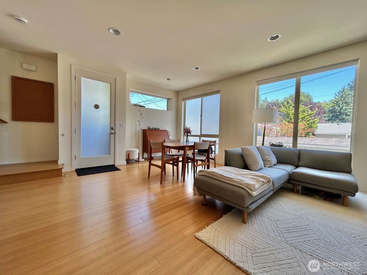 4852 40th Avenue Southwest, Unit B Seattle, WA 98116 - Photo 4 of 25 a living room with furniture and a large window