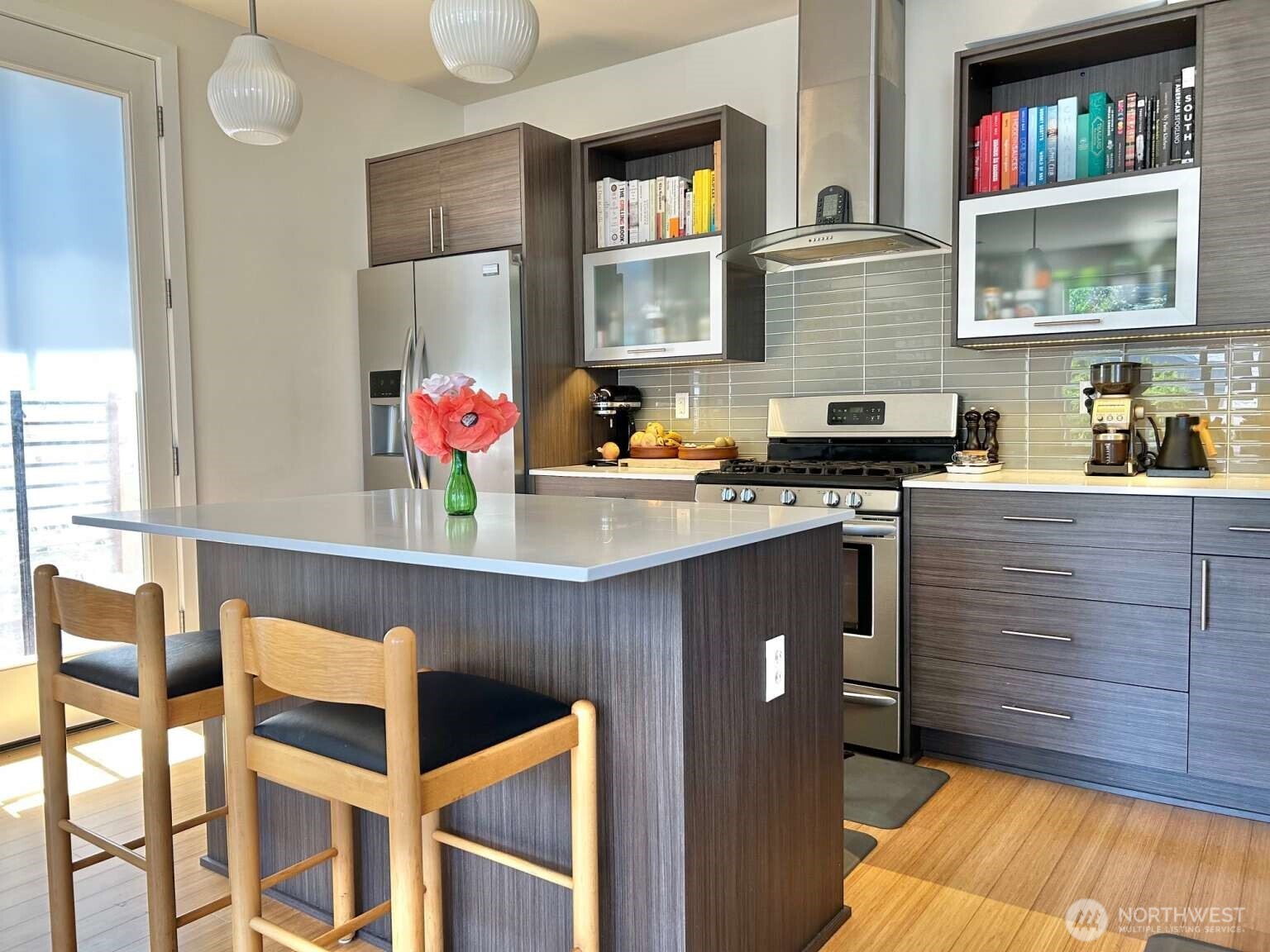 4852 40th Avenue Southwest, Unit B Seattle, WA 98116 - Photo 10 of 25 a kitchen with stainless steel appliances granite countertop a stove a sink and a refrigerator