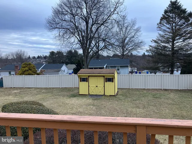 a view of a wooden fence