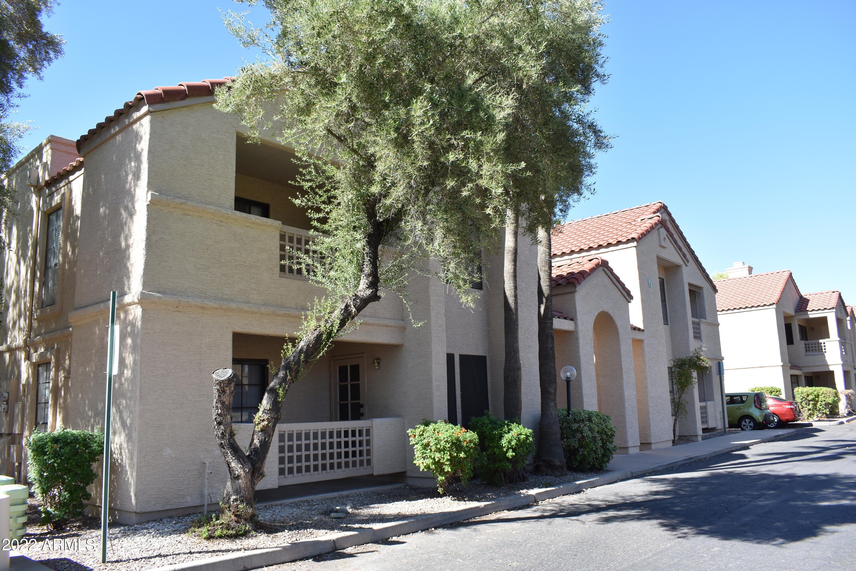 2855 South Ext Road, Unit 135 Mesa, AZ 85210 - Photo 1 of 19 a front view of a house with a yard