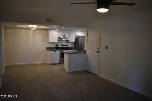a kitchen with stainless steel appliances a stove a refrigerator and a sink