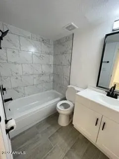 a bathroom with a toilet a sink and bathtub