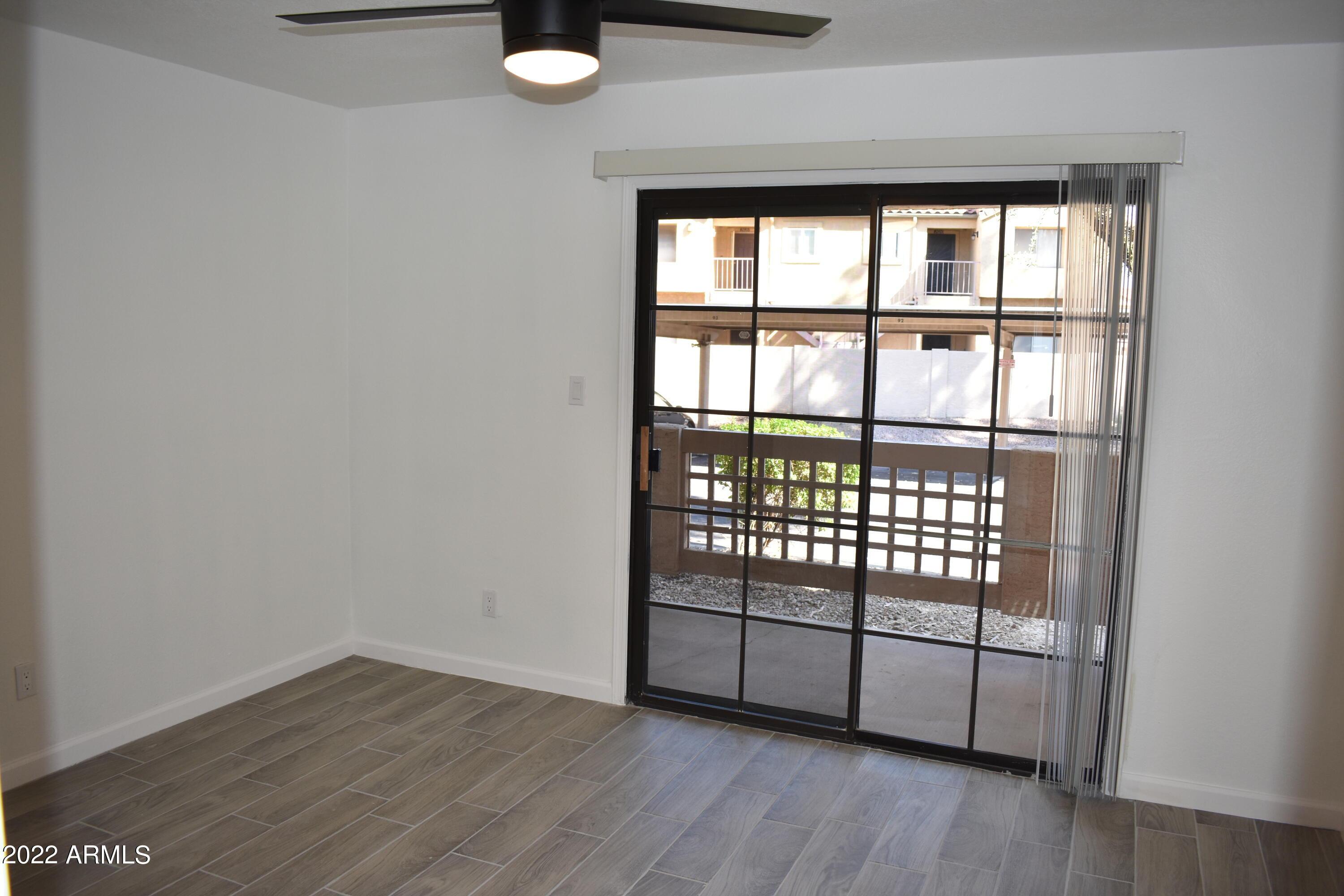 2855 South Ext Road, Unit 135 Mesa, AZ 85210 - Photo 10 of 19 a view of a room with racks on the wall and a window