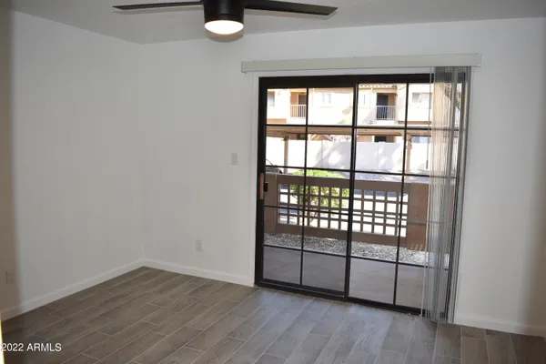 a view of a room with racks on the wall and a window