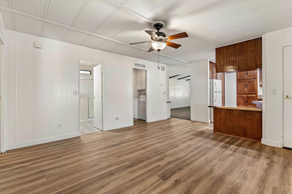 650 South Rancho Santa Fe Road, Unit 312 San Marcos, CA 92078 - Photo 17 of 53 a view of an empty room with window and wooden floor