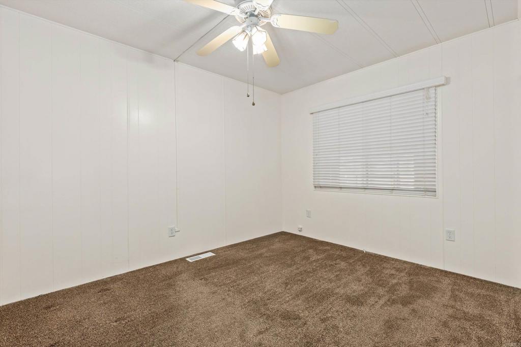 650 South Rancho Santa Fe Road, Unit 312 San Marcos, CA 92078 - Photo 25 of 53 an empty room with a window and a fan