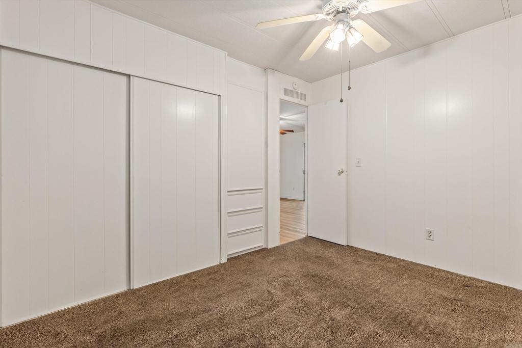 650 South Rancho Santa Fe Road, Unit 312 San Marcos, CA 92078 - Photo 26 of 53 an empty room with closet and fan