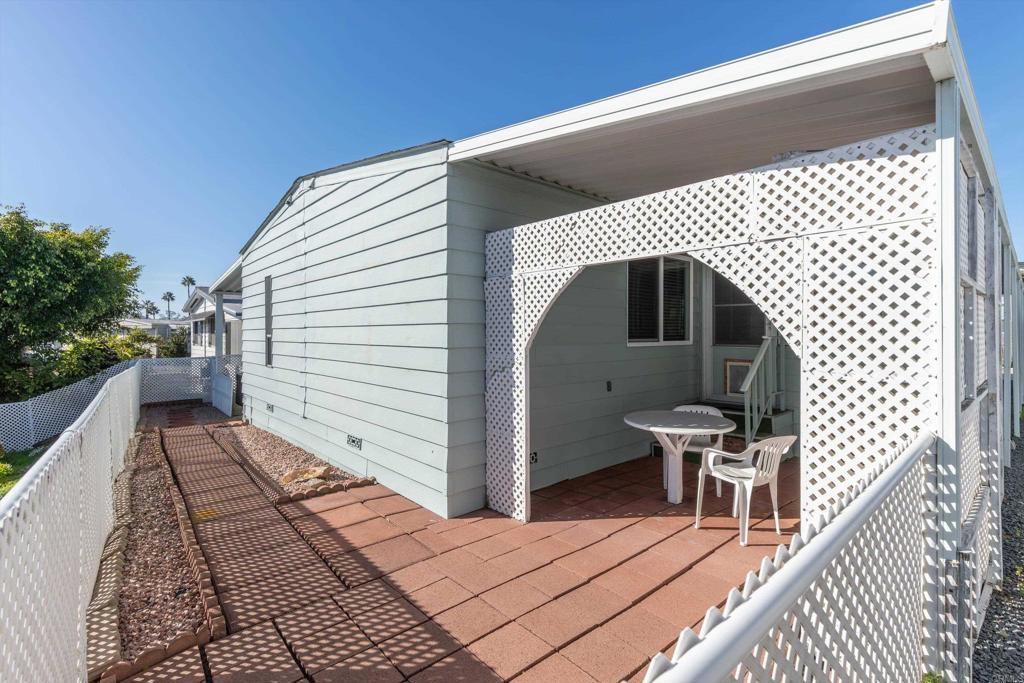 650 South Rancho Santa Fe Road, Unit 312 San Marcos, CA 92078 - Photo 31 of 53 a view of a wooden house with a bench