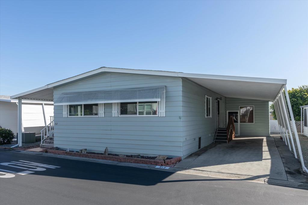 650 South Rancho Santa Fe Road, Unit 312 San Marcos, CA 92078 - Photo 36 of 53 a view of a house with a patio