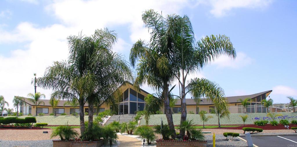 650 South Rancho Santa Fe Road, Unit 312 San Marcos, CA 92078 - Photo 38 of 53 a view of multiple houses with palm trees