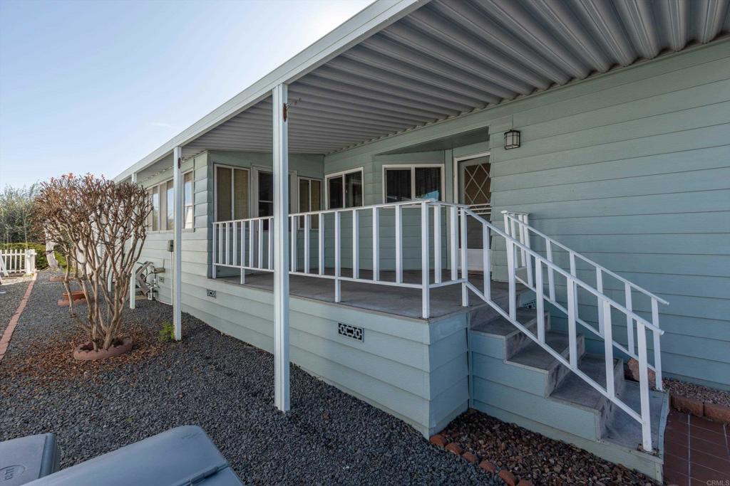 650 South Rancho Santa Fe Road, Unit 312 San Marcos, CA 92078 - Photo 4 of 53 a view of a house with backyard and wooden fence