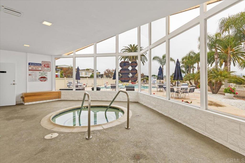 650 South Rancho Santa Fe Road, Unit 312 San Marcos, CA 92078 - Photo 41 of 53 a swimming pool with outdoor seating and yard