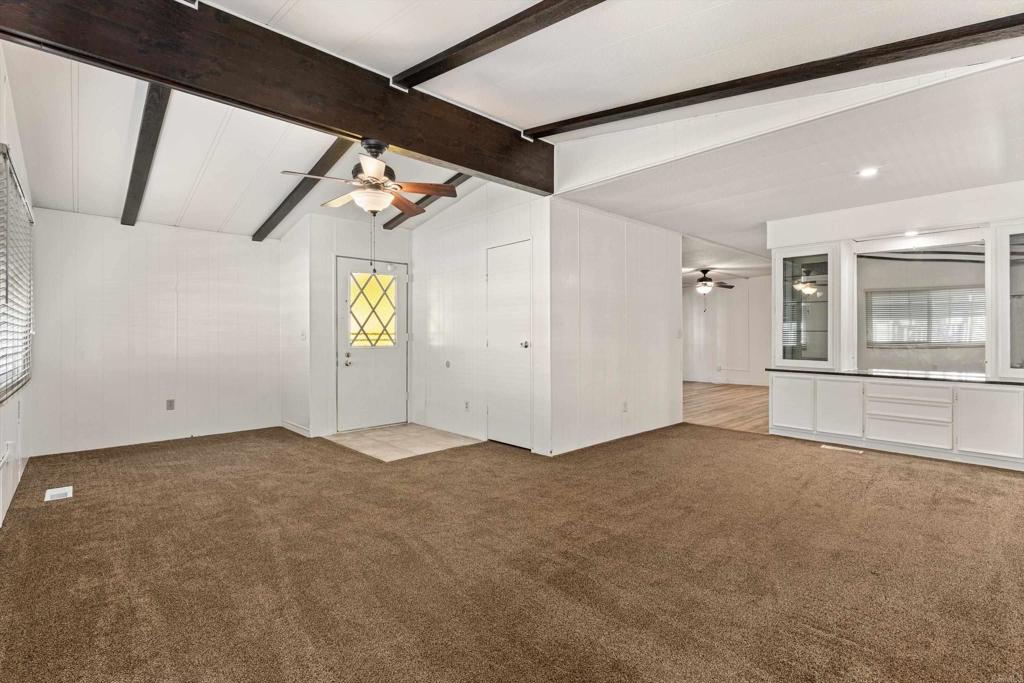 650 South Rancho Santa Fe Road, Unit 312 San Marcos, CA 92078 - Photo 8 of 53 an empty room with windows and entrance