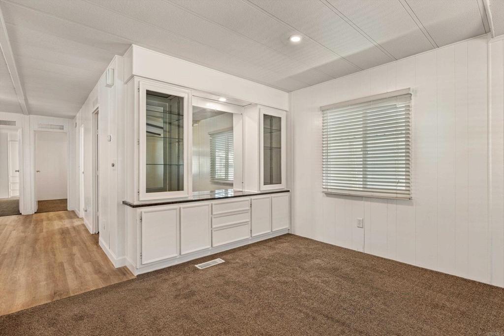 650 South Rancho Santa Fe Road, Unit 312 San Marcos, CA 92078 - Photo 10 of 53 a view of an empty room with window and cabinet