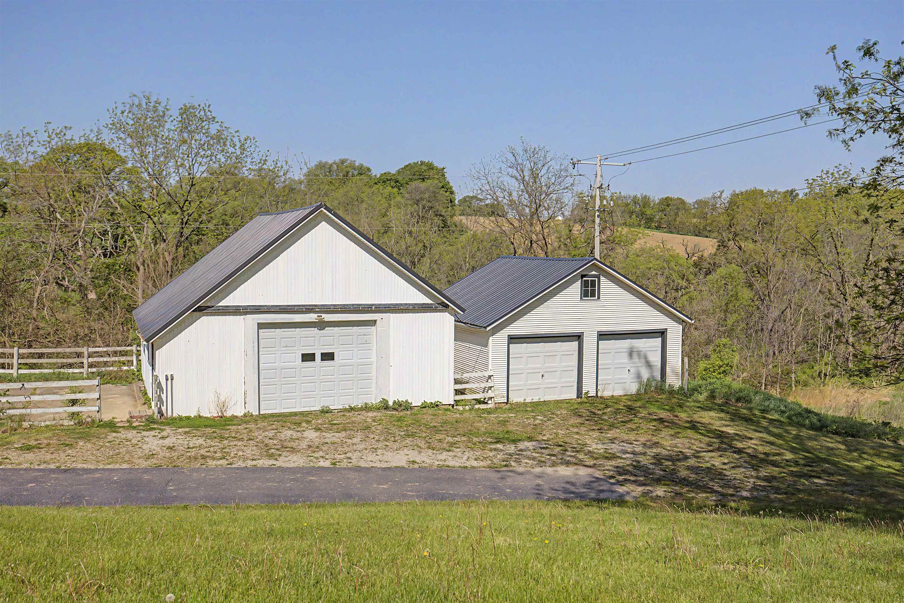17380 Corbett Road Mount Carroll, IL 61053 - Photo 53 of 65 front view of a house with a yard