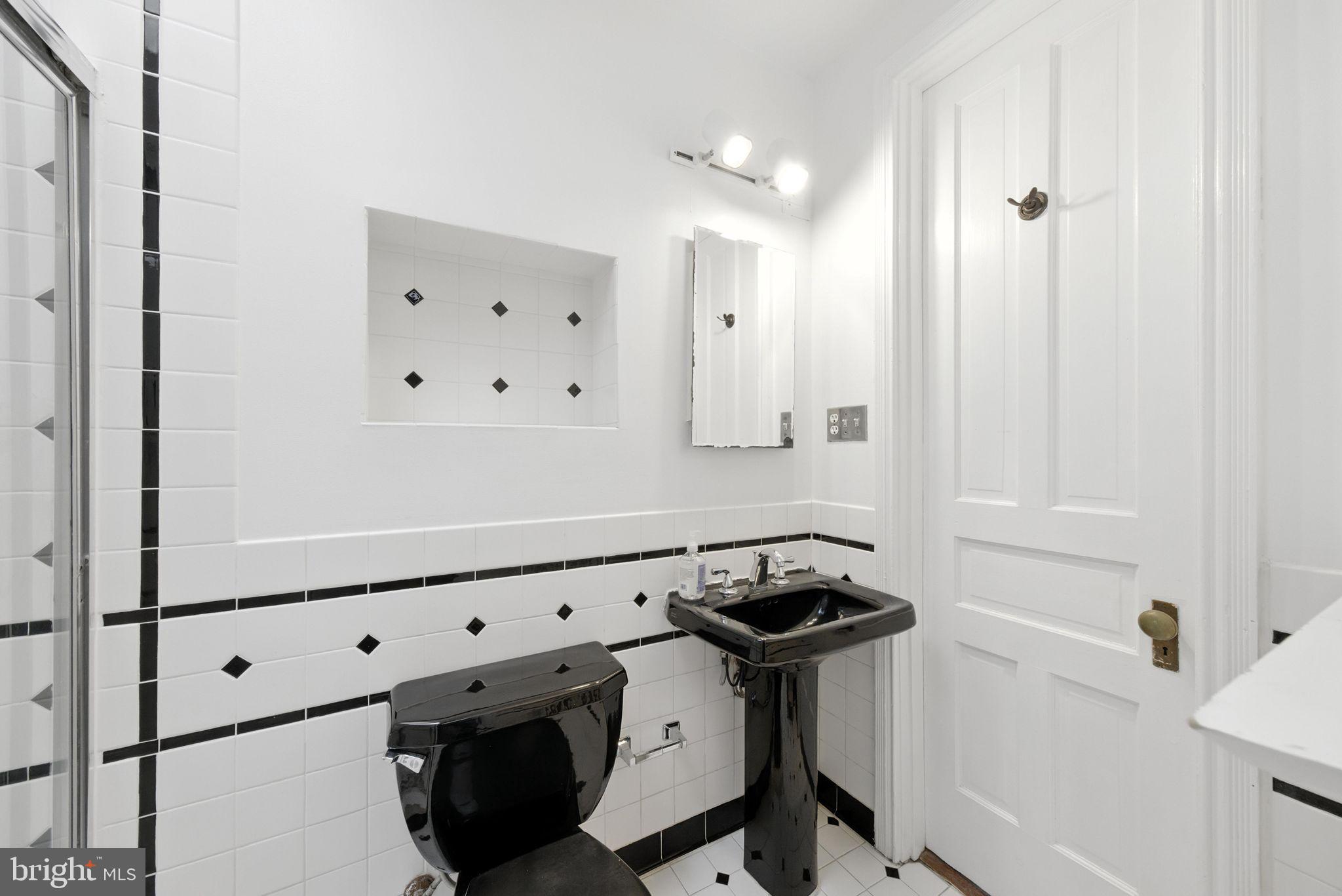 1763 U Street Northwest Washington, DC 20009 - Photo 23 of 29 a room with stainless steel appliances cabinets and wooden floor