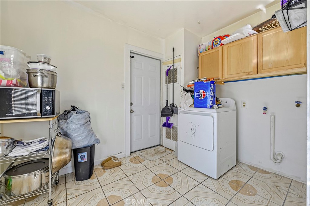 1054 West 24th Street Merced, CA 95340 - Photo 21 of 39 a room with storage and utility
