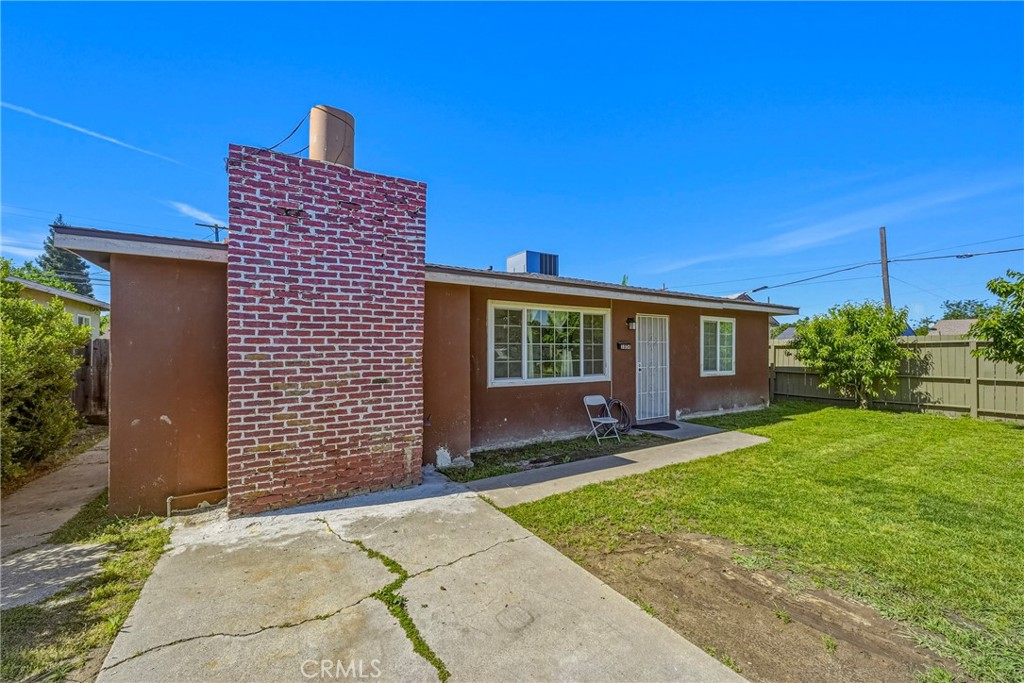 1054 West 24th Street Merced, CA 95340 - Photo 5 of 39 a brick house with garden in front of it