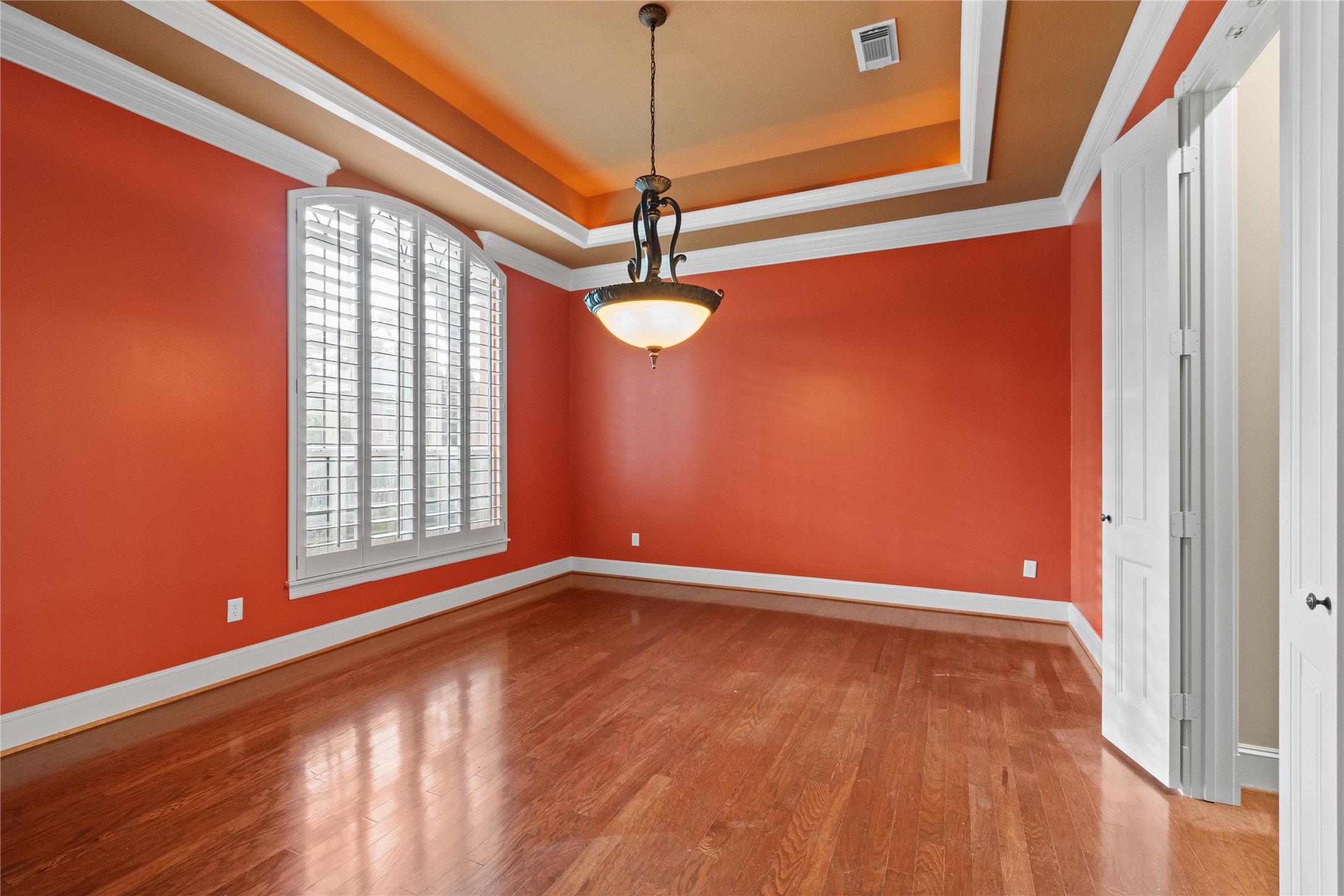 16626 Lafone Drive Spring, TX 77379 - Photo 15 of 42 A formal dining room to the left of the ront door...and connects to the kitchen through the butler's pantry on the right side. Did you notice the tray ceiling and plantation shutters?
