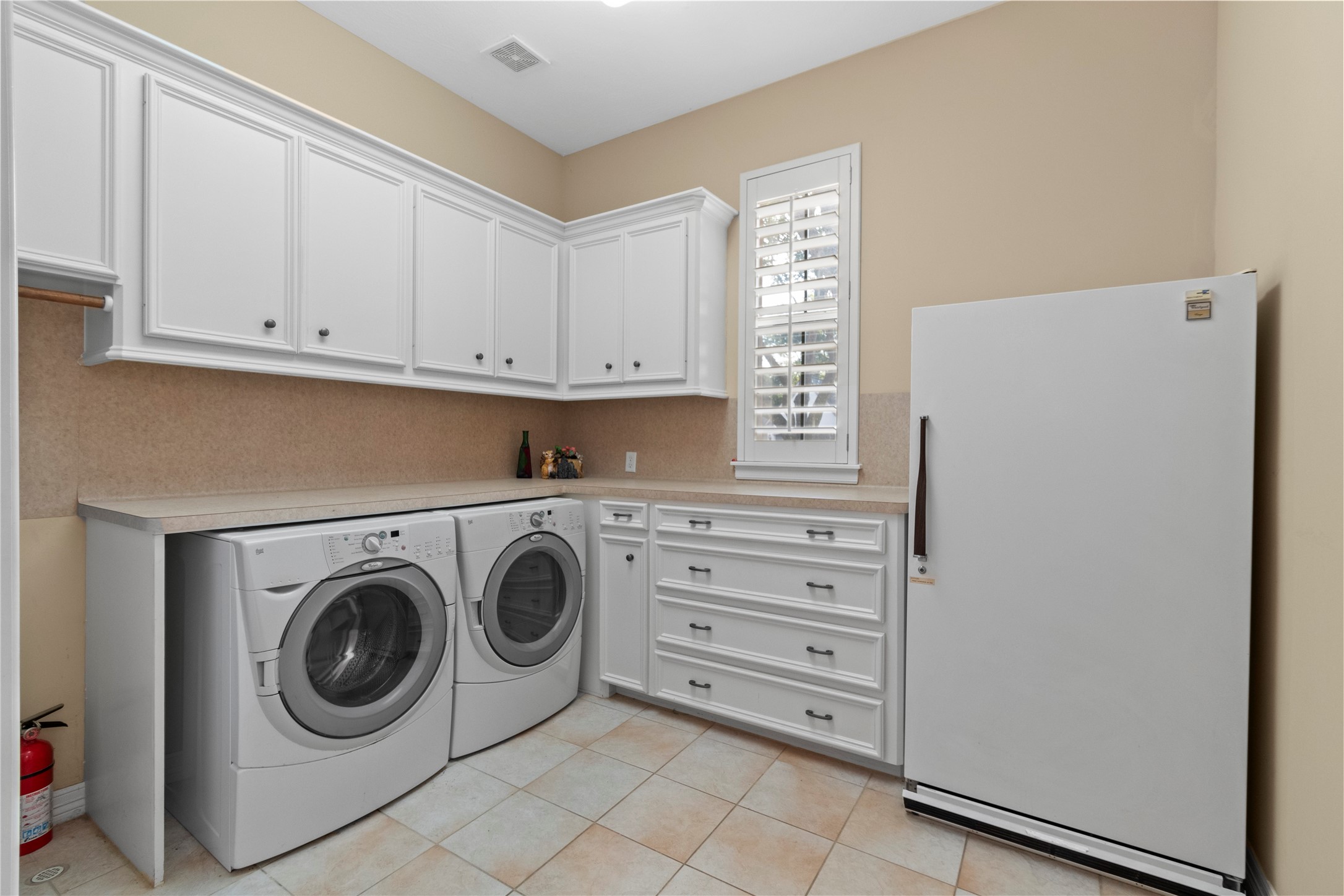 16626 Lafone Drive Spring, TX 77379 - Photo 38 of 42 Utility room INCLUDES the washer, dryer AND Fridge. But wait, there's more....
