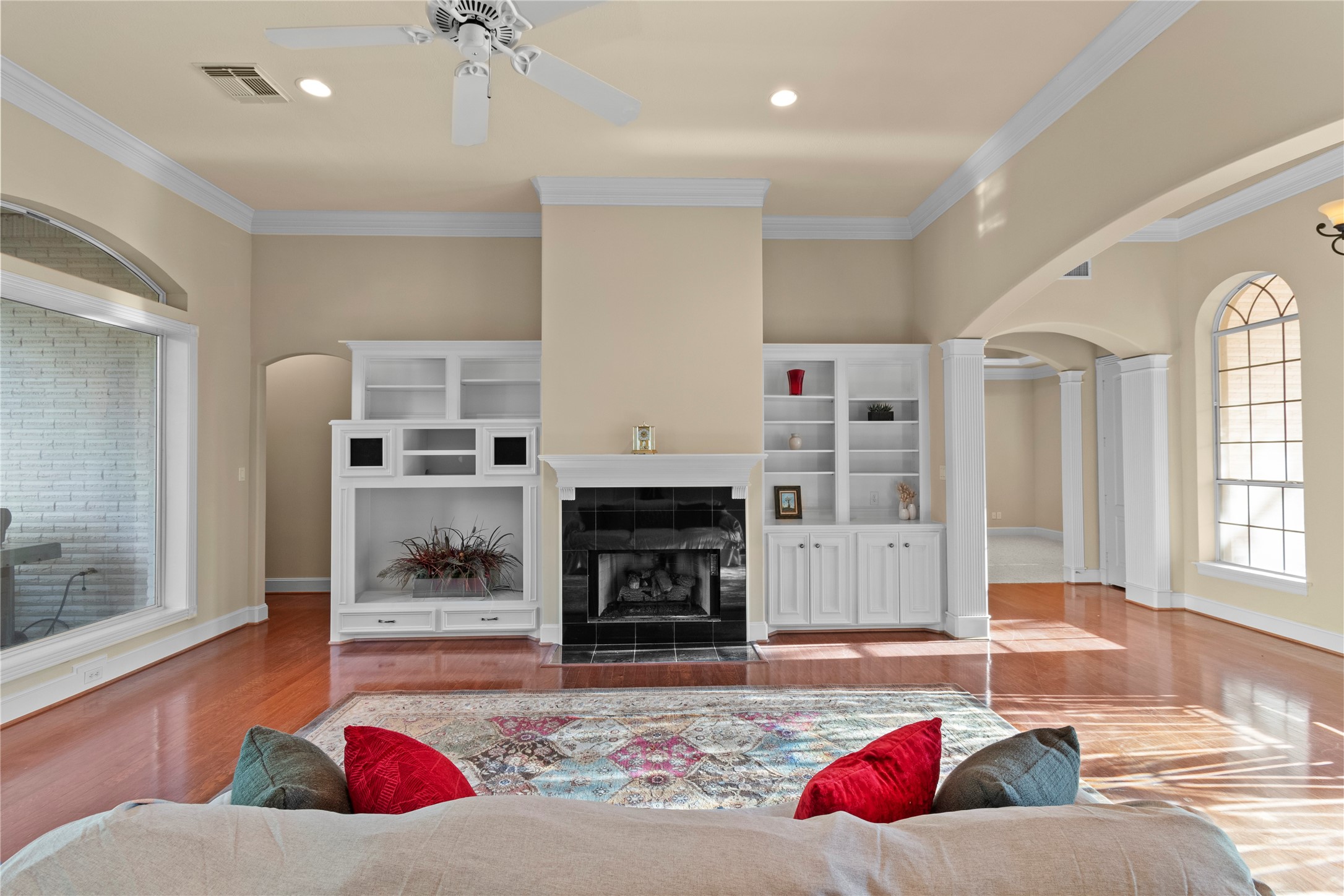 16626 Lafone Drive Spring, TX 77379 - Photo 5 of 42 Family Room with hardwood floors, crown molding, built-ins and tons of natural light. Custom built-ins and a gas fireplace.