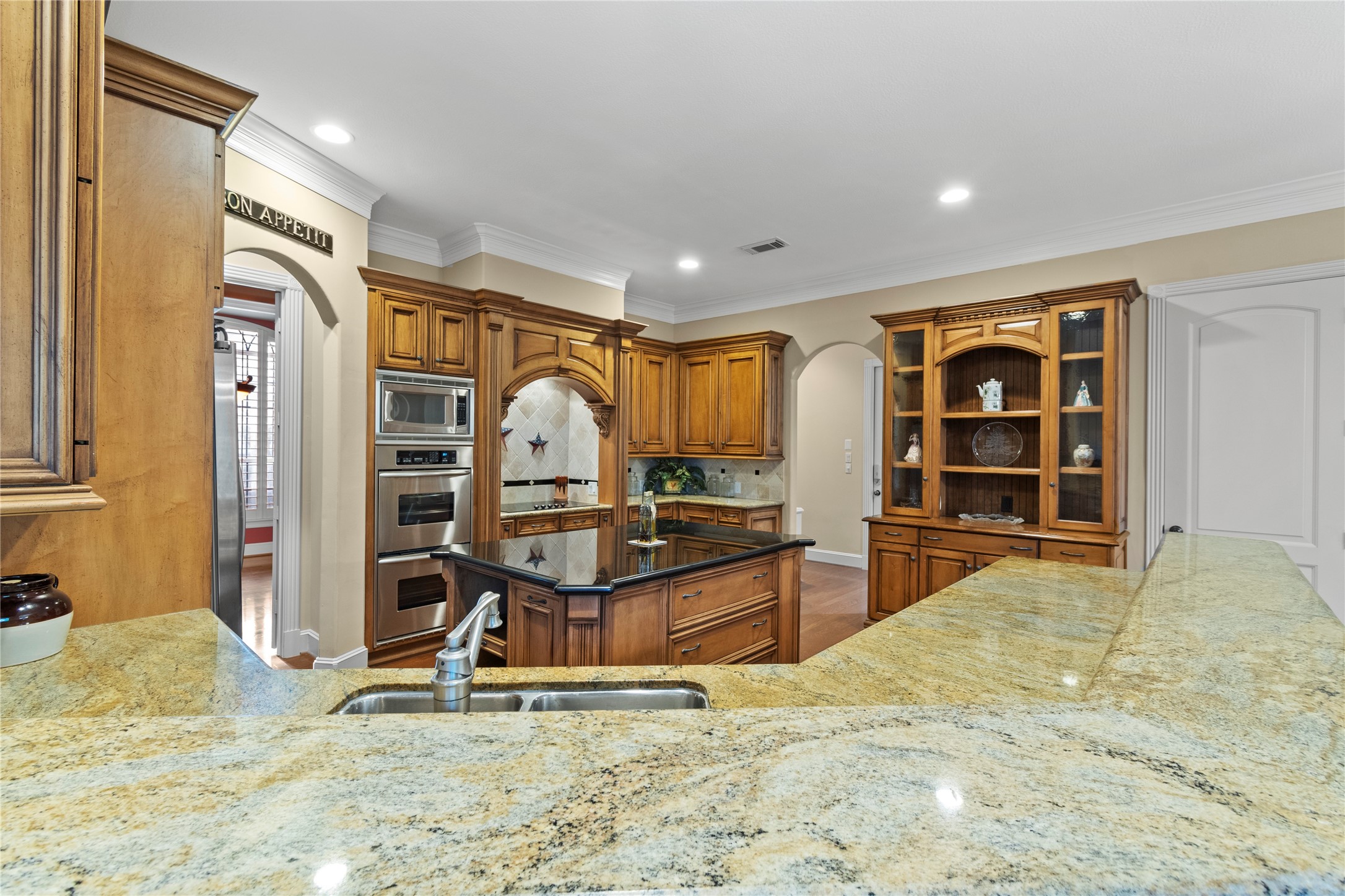16626 Lafone Drive Spring, TX 77379 - Photo 7 of 42 This is a kitchen! Gorgeous granite counters, pots and pans drawers, stainless appliances including the double oven, microwave, warming drawer and dishwasher. Under cabinet lighting throughout. Great space for cooking and entertaining.