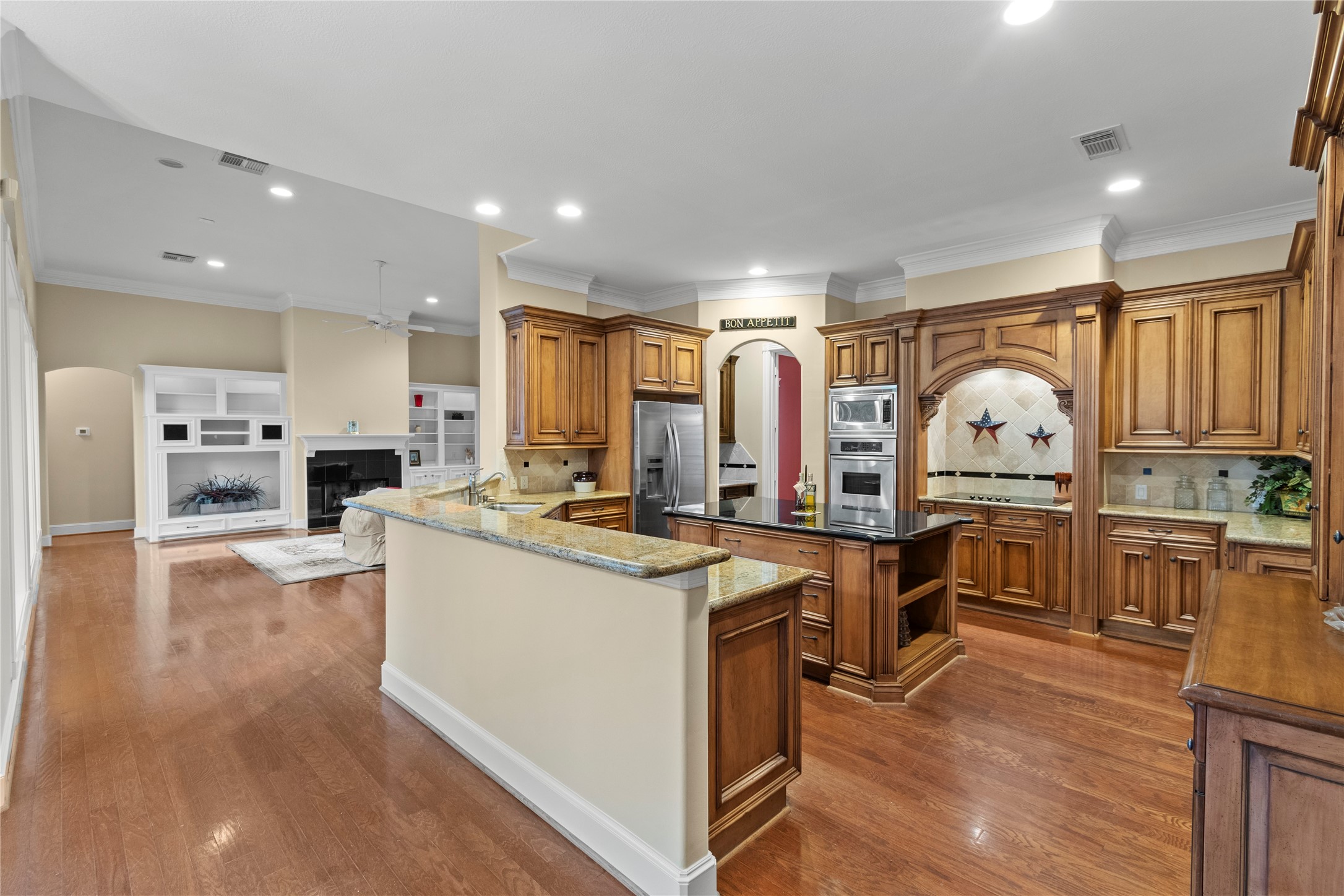 16626 Lafone Drive Spring, TX 77379 - Photo 8 of 42 So much space! Storage! Counters for prep cooking and entertaining. Double oven. Custom built-ins. A butler's pantry jsut past the fridge takes you to the dining room.