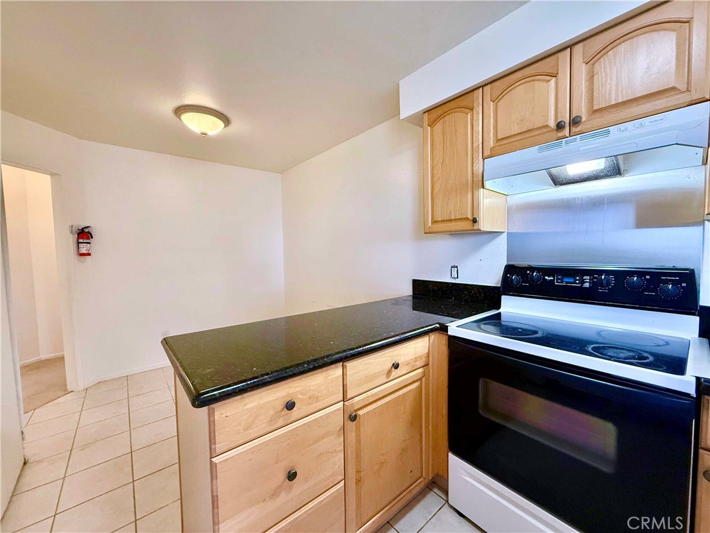 5965 Peacock Ridge Road, Unit 301 Rancho Palos Verdes, CA 90275 - Photo 14 of 31 a kitchen with granite countertop cabinets and steel stainless steel appliances