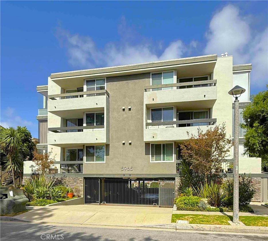 5965 Peacock Ridge Road, Unit 301 Rancho Palos Verdes, CA 90275 - Photo 2 of 31 a front view of a building with a garden
