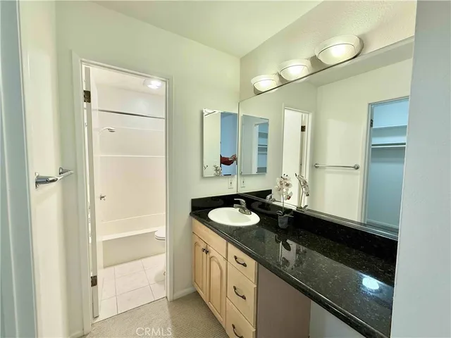 a view of an empty room with glass door