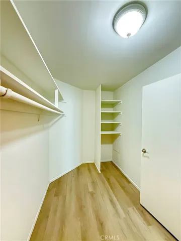 a white toilet sitting next to a bath tub and shower