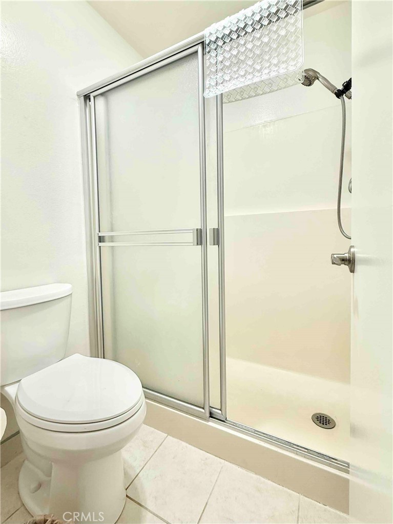 5965 Peacock Ridge Road, Unit 301 Rancho Palos Verdes, CA 90275 - Photo 28 of 31 a white toilet sitting next to a bath tub and shower