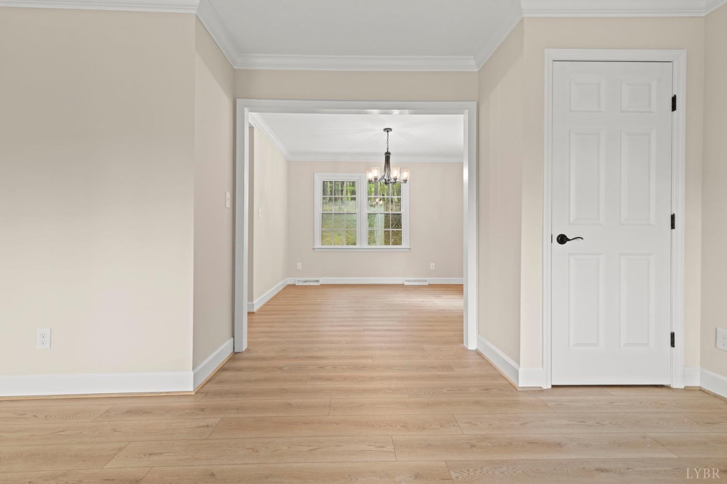 2252 Coffee Road Lynchburg, VA 24503 - Photo 22 of 93 a view of an empty room with wooden floor and a window