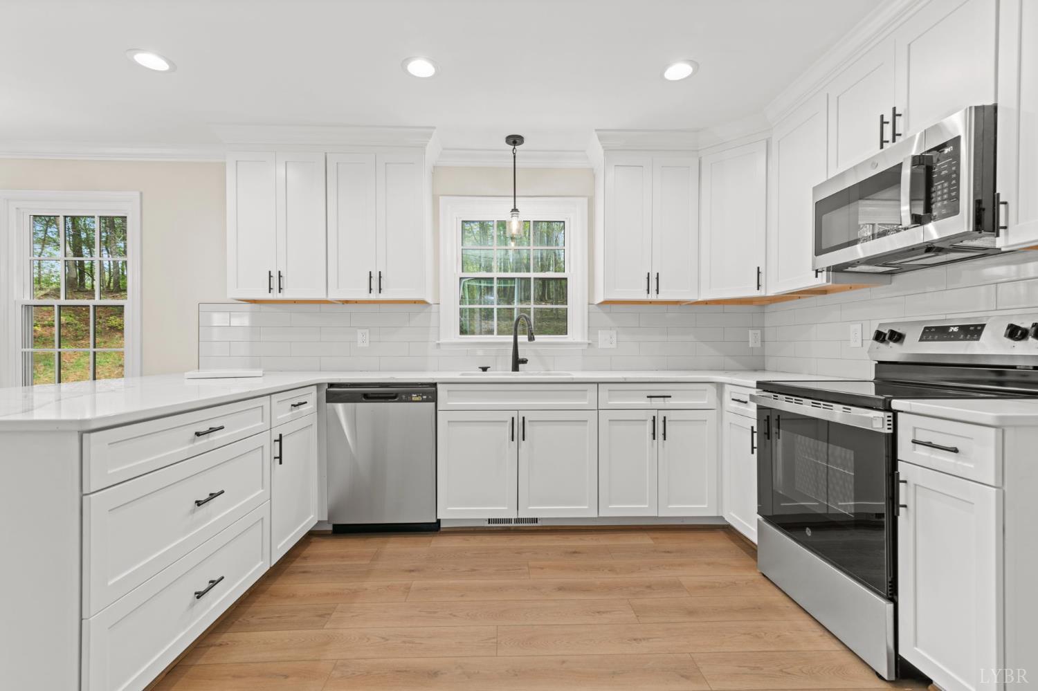 2252 Coffee Road Lynchburg, VA 24503 - Photo 29 of 93 a kitchen with granite countertop white cabinets stainless steel appliances a sink and a window