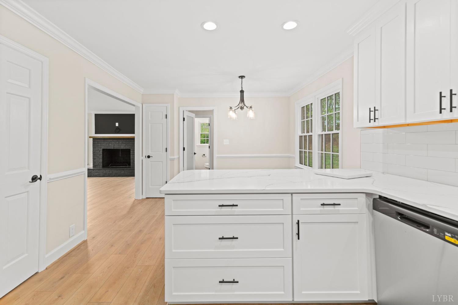 2252 Coffee Road Lynchburg, VA 24503 - Photo 31 of 93 a kitchen with granite countertop white cabinets and white appliances