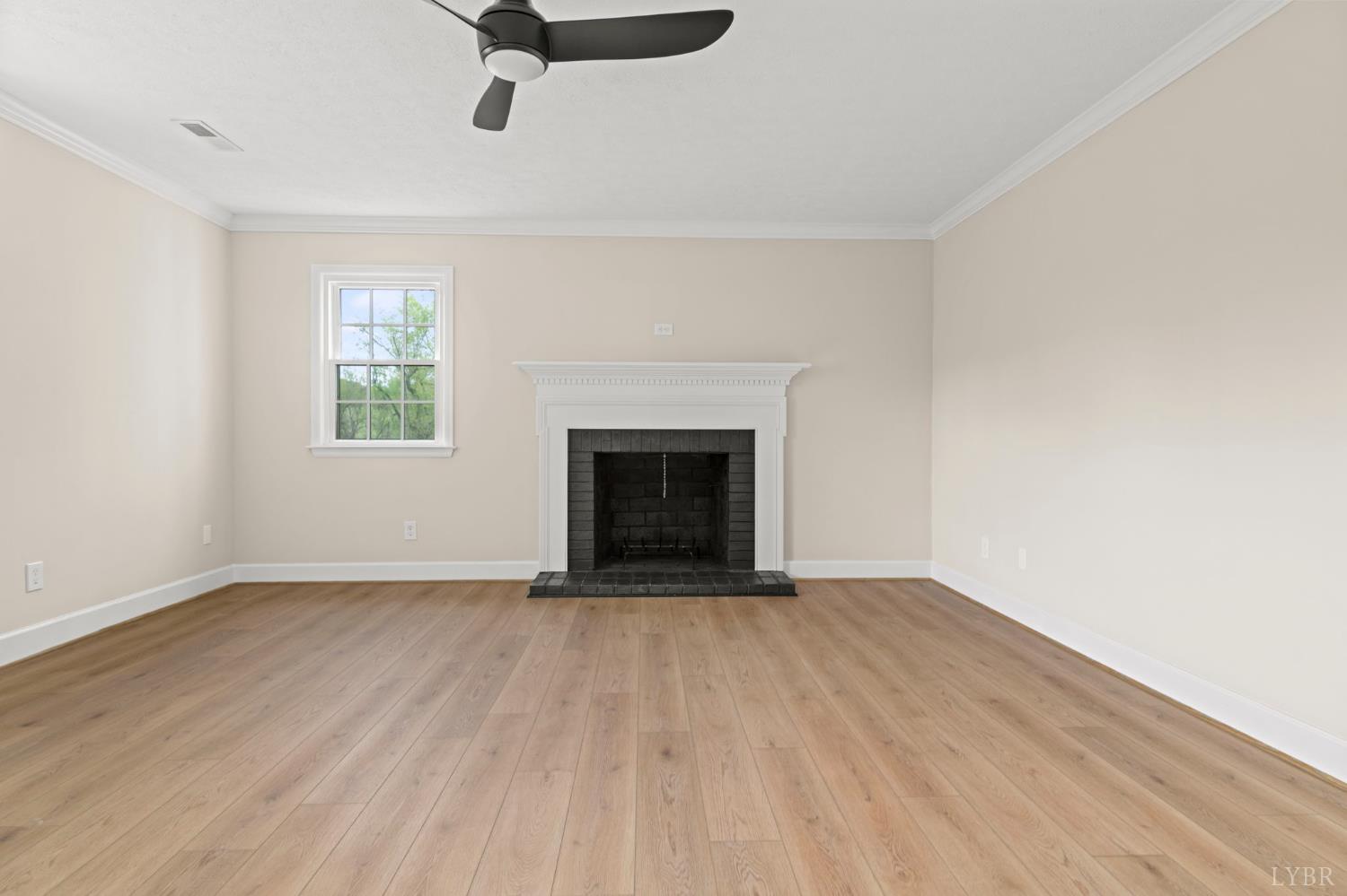 2252 Coffee Road Lynchburg, VA 24503 - Photo 54 of 93 wooden floor fireplace and window in an empty room