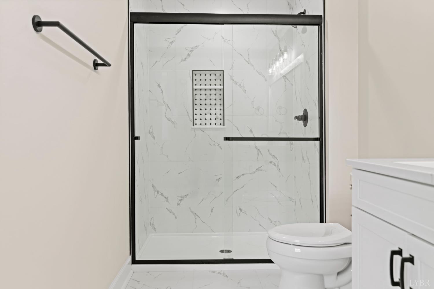 2252 Coffee Road Lynchburg, VA 24503 - Photo 64 of 93 a bathroom with a shower a toilet and a shower curtain