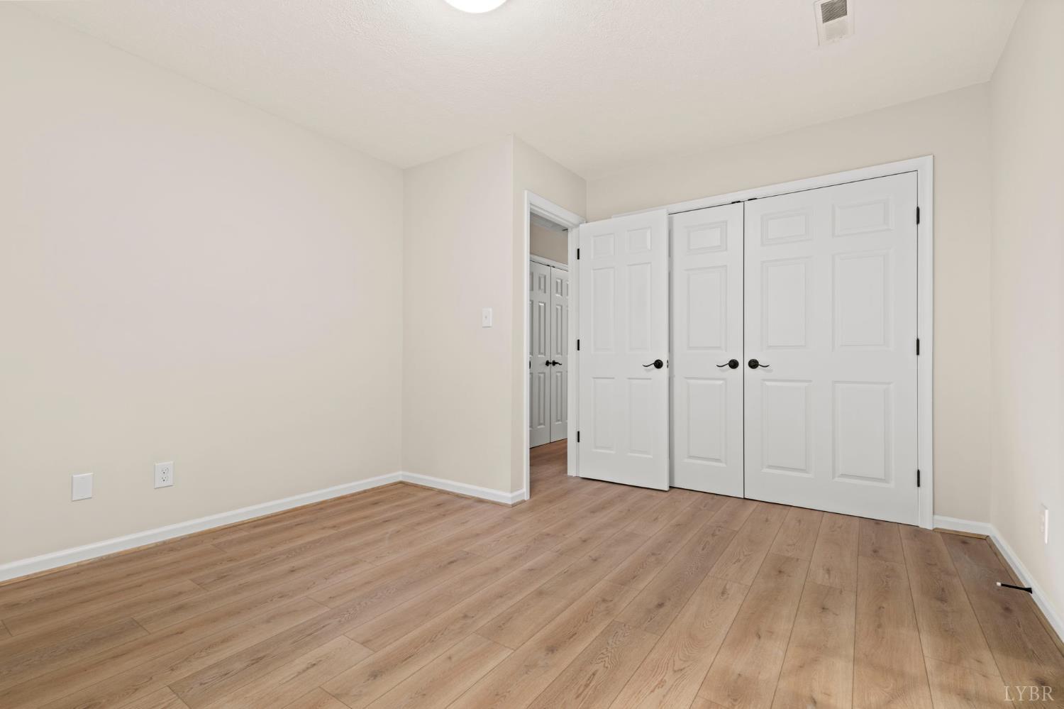 2252 Coffee Road Lynchburg, VA 24503 - Photo 74 of 93 a view of an empty room with wooden floor