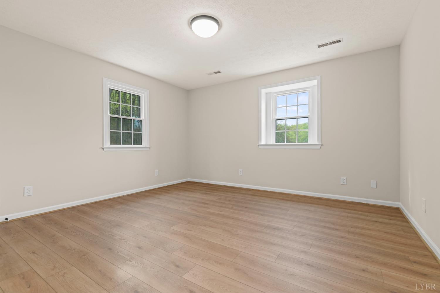 2252 Coffee Road Lynchburg, VA 24503 - Photo 75 of 93 an empty room with wooden floor and windows