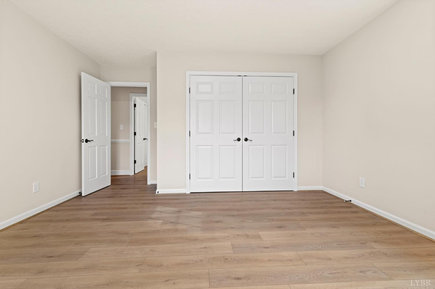 2252 Coffee Road Lynchburg, VA 24503 - Photo 76 of 93 a view of an empty room with wooden floor