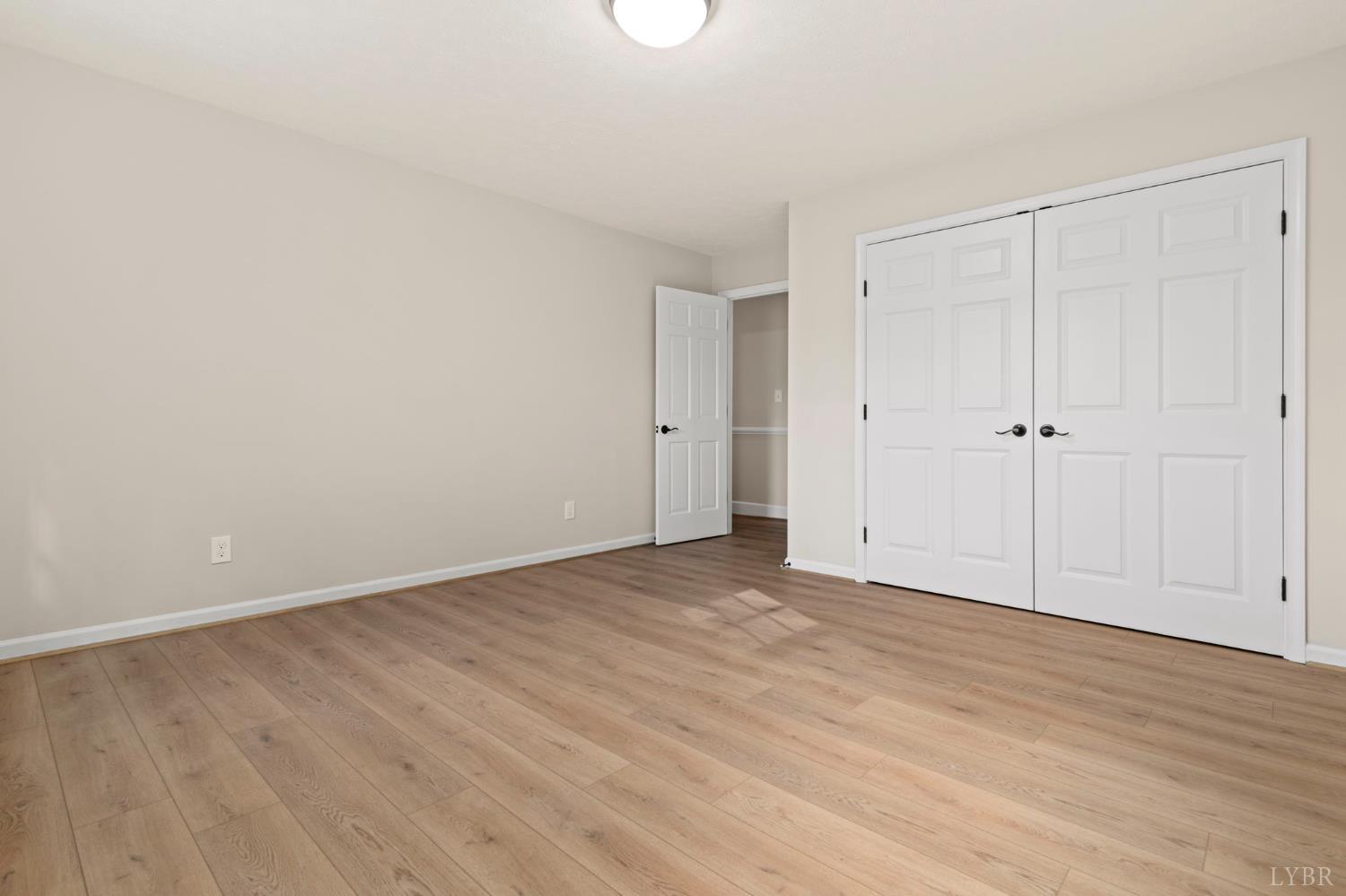 2252 Coffee Road Lynchburg, VA 24503 - Photo 78 of 93 a view of an empty room with wooden floor