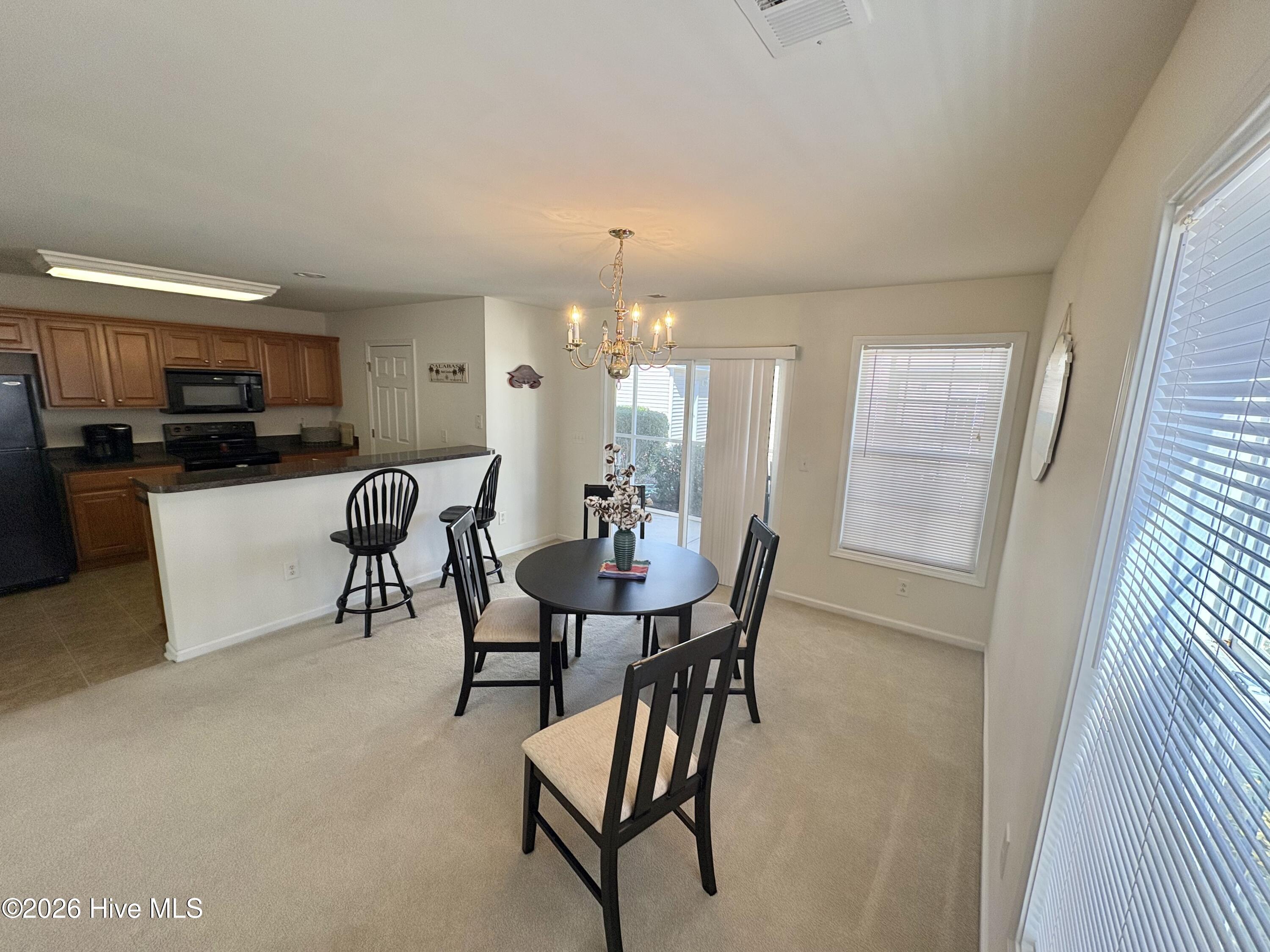 111 Cobblers Circle Calabash, NC 28467 - Photo 12 of 21 Large, open area for gathering.