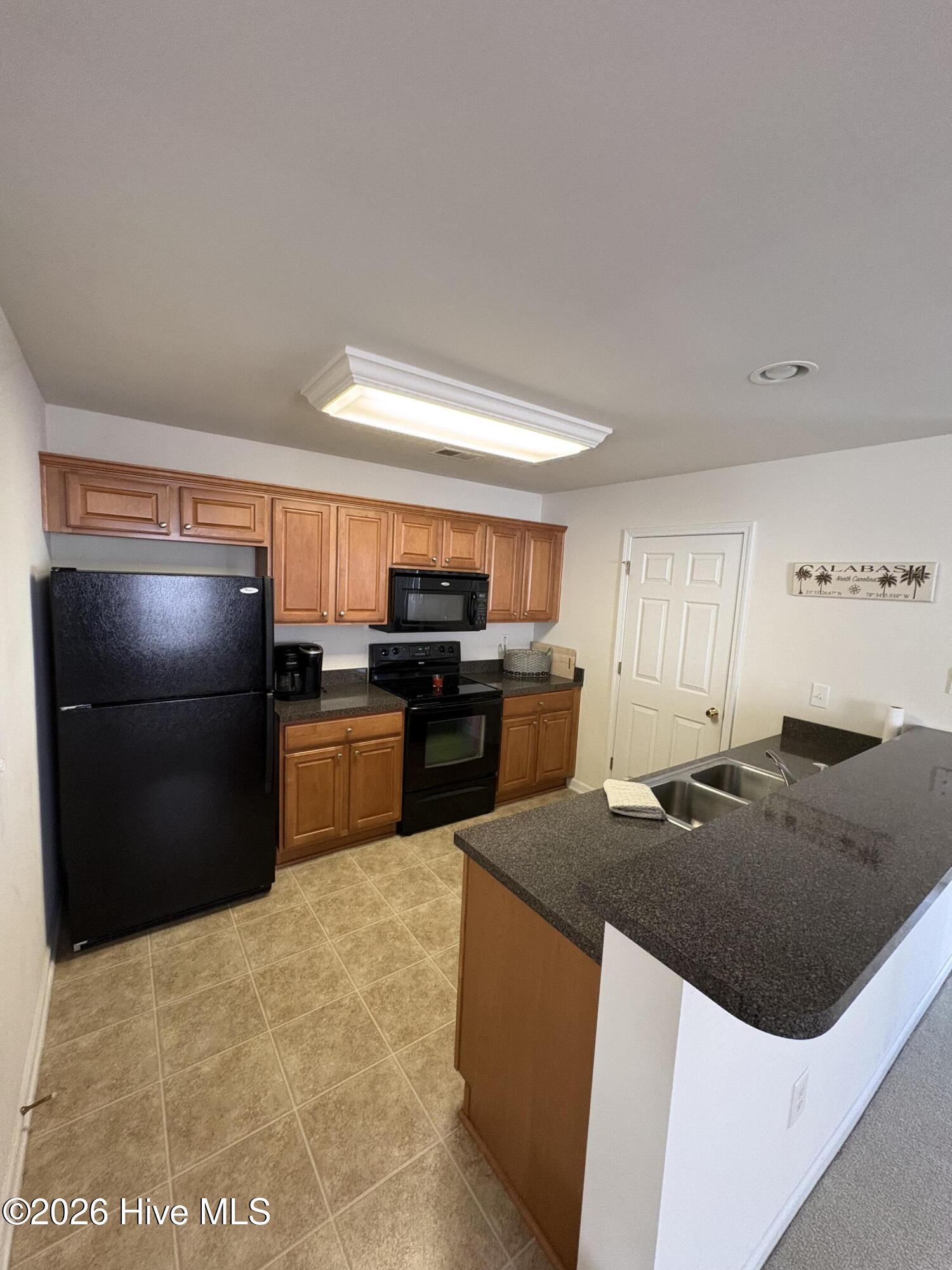 111 Cobblers Circle Calabash, NC 28467 - Photo 13 of 21 Doors open to laundry.