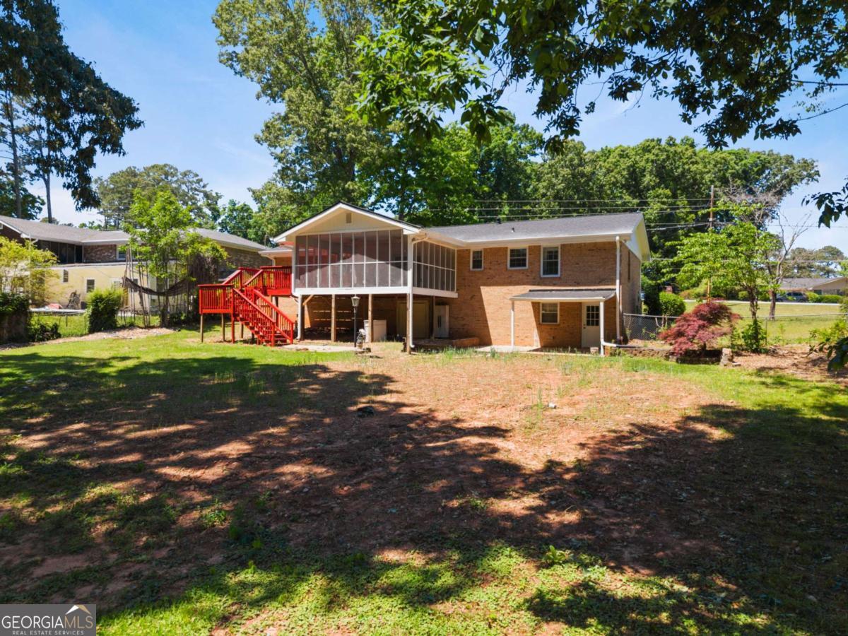 865 Old Tucker Road Stone Mountain, GA 30087 - Photo 46 of 57 a front view of a house with garden